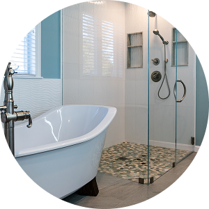 Bathroom remodel with freestanding tub, frameless shower, mosaic tile floor, and brushed nickel fixtures